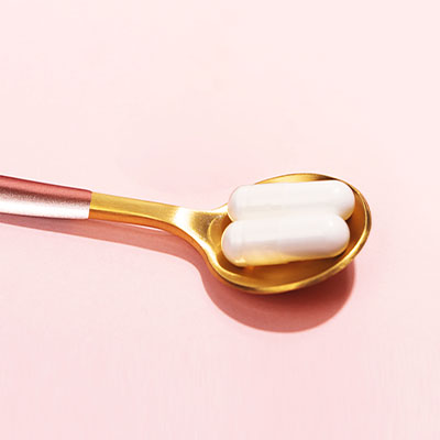 capules on a spoon