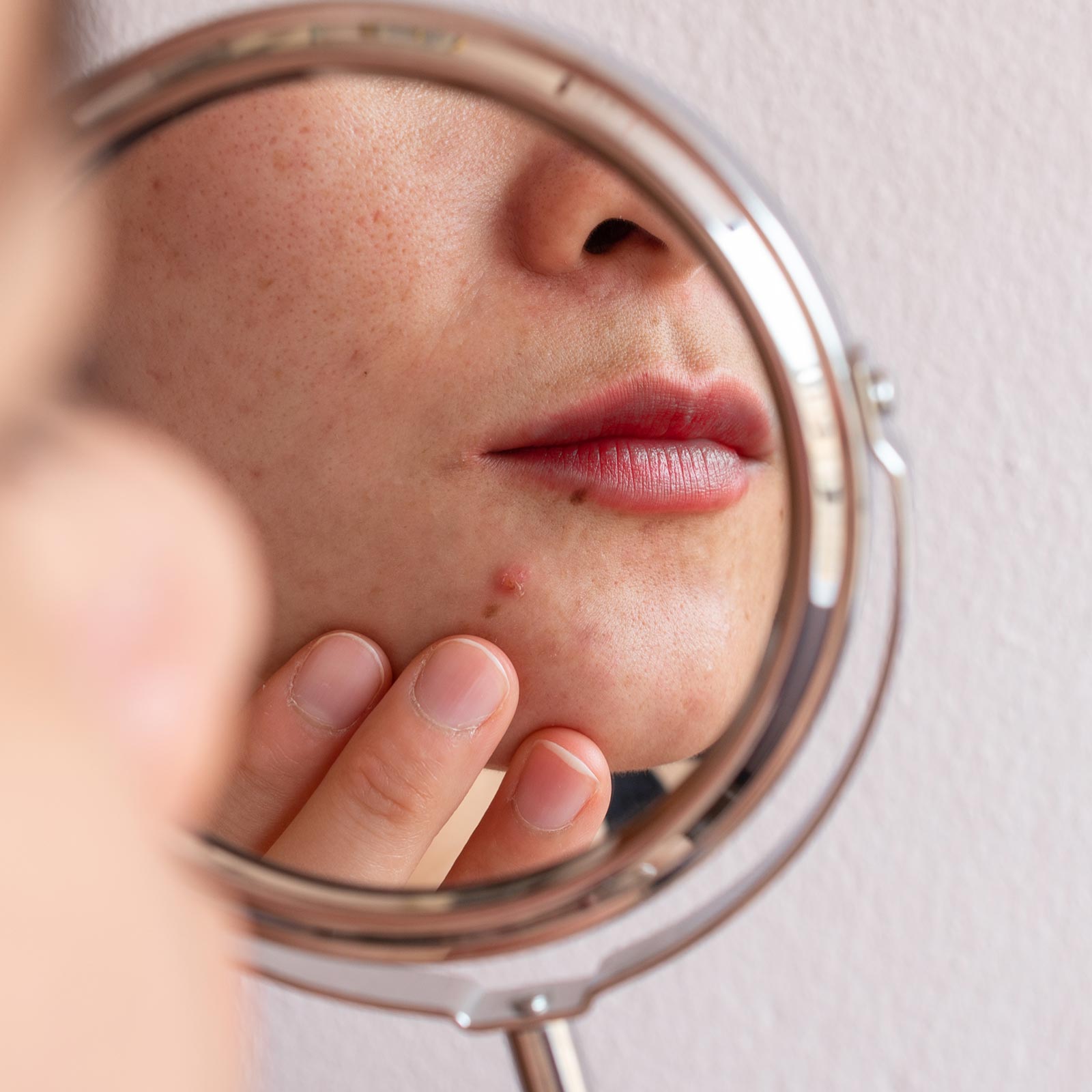 woman looking in the mirror